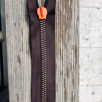 High quality metal zip with orange lacquered slider